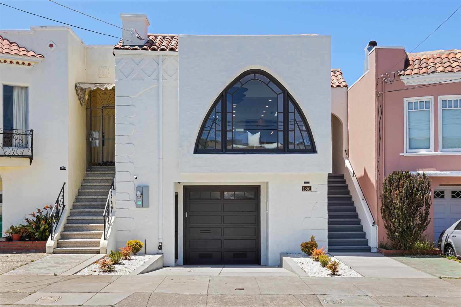 Rebuilt home with black-framed cathedral arch window, 40th Avenue, San Francisco