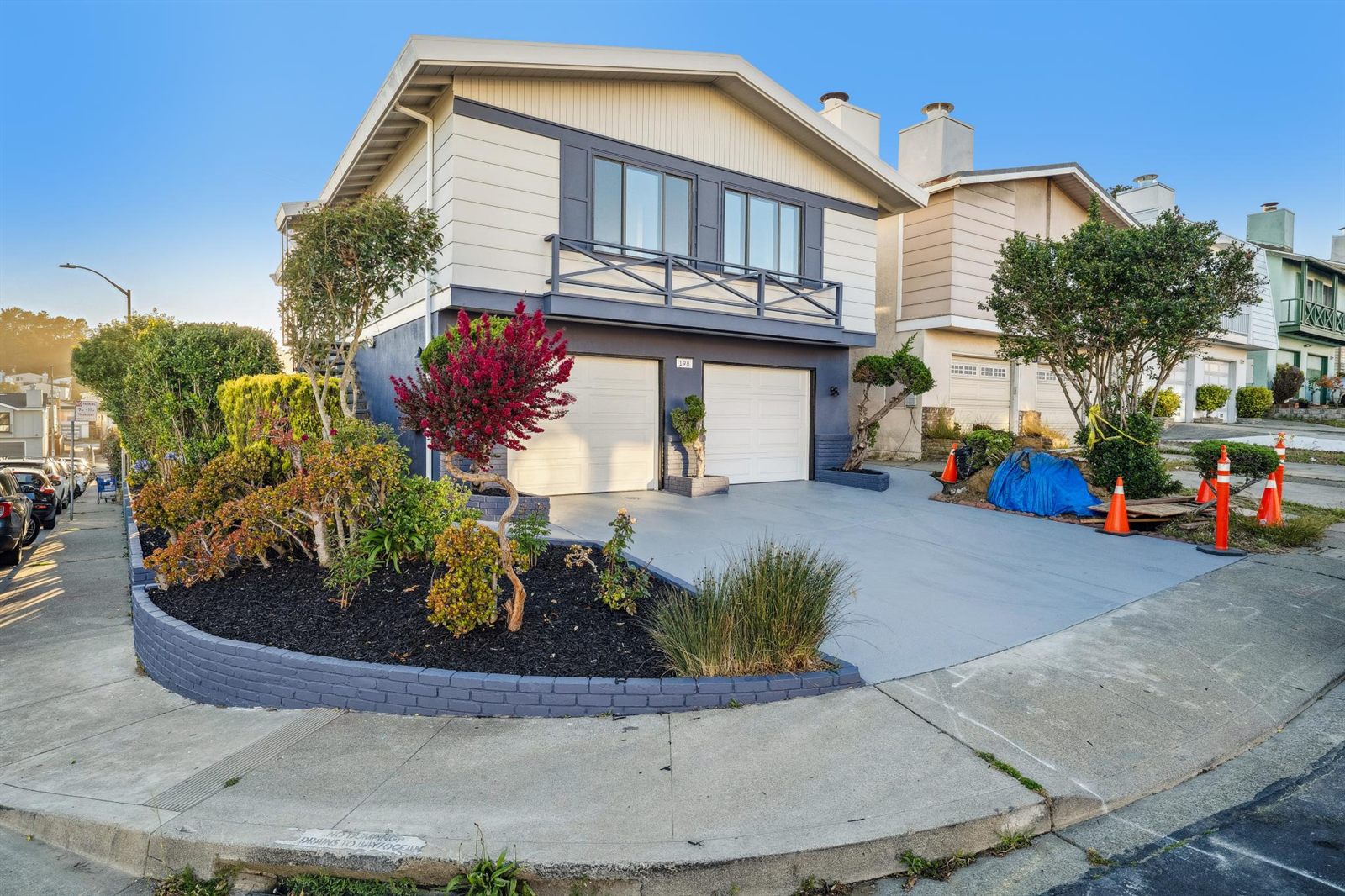 Rebuilt corner home with new siding, balcony railing and landscaped planter wall, Shipley Avenue, Daly City