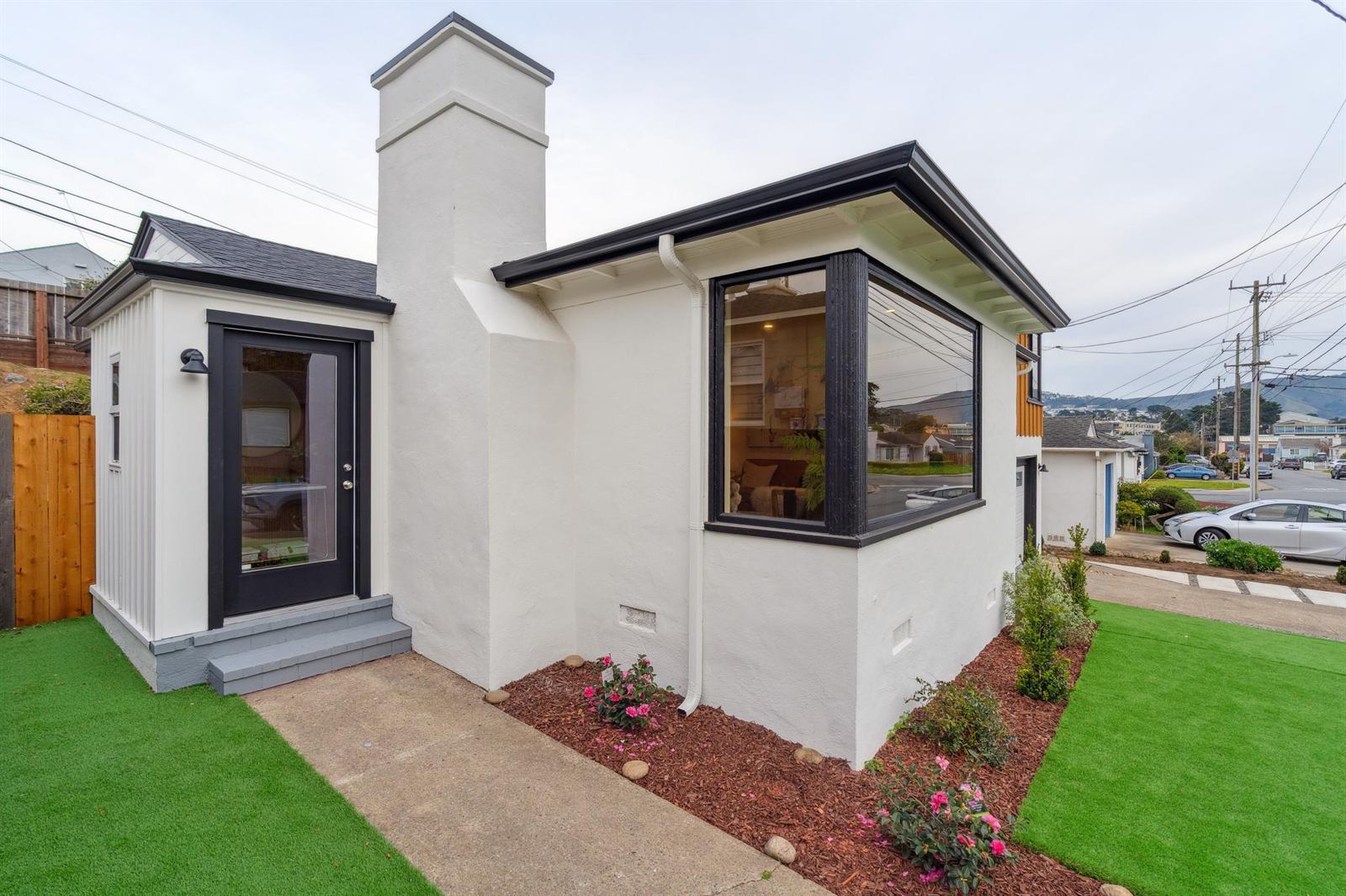 Remodeled corner home with black trim and new landscaping, Wildwood Avenue, Daly City